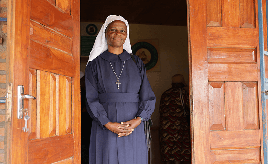 Sister Prisca standing in a doorway