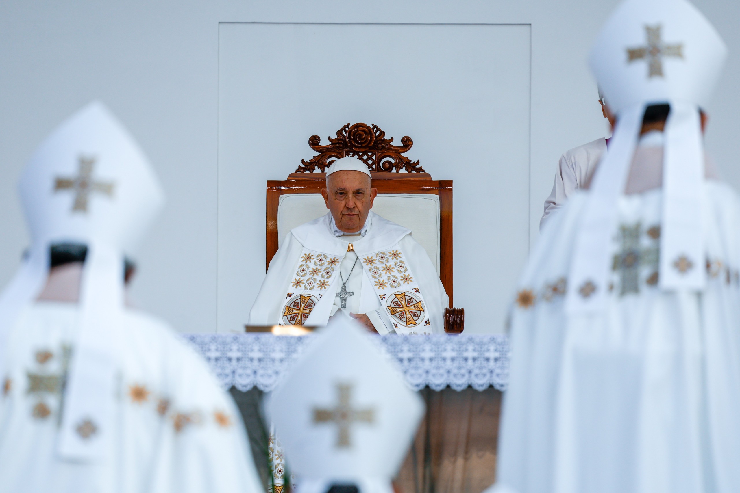 Pope Francis watches the entrance procession as he celebrates Mass in Indonesia.