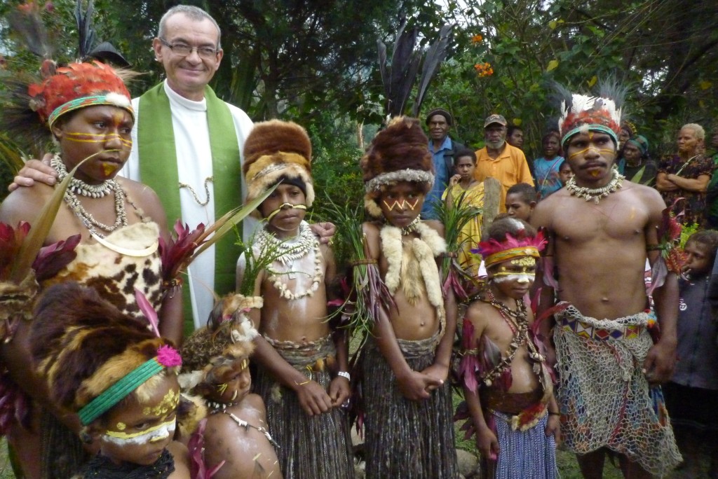 Papua New Guinea: A missionary priest readies to celebrate Mass.