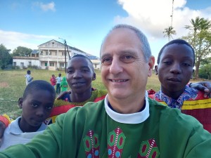 Father Juan Gabriel Arias, second in the left, an Argentine missionary priest who has long worked to bring the Joy of the Gospel to Mozambique. His parishe is one of thousands that benefits from the World Mission Sunday collection.