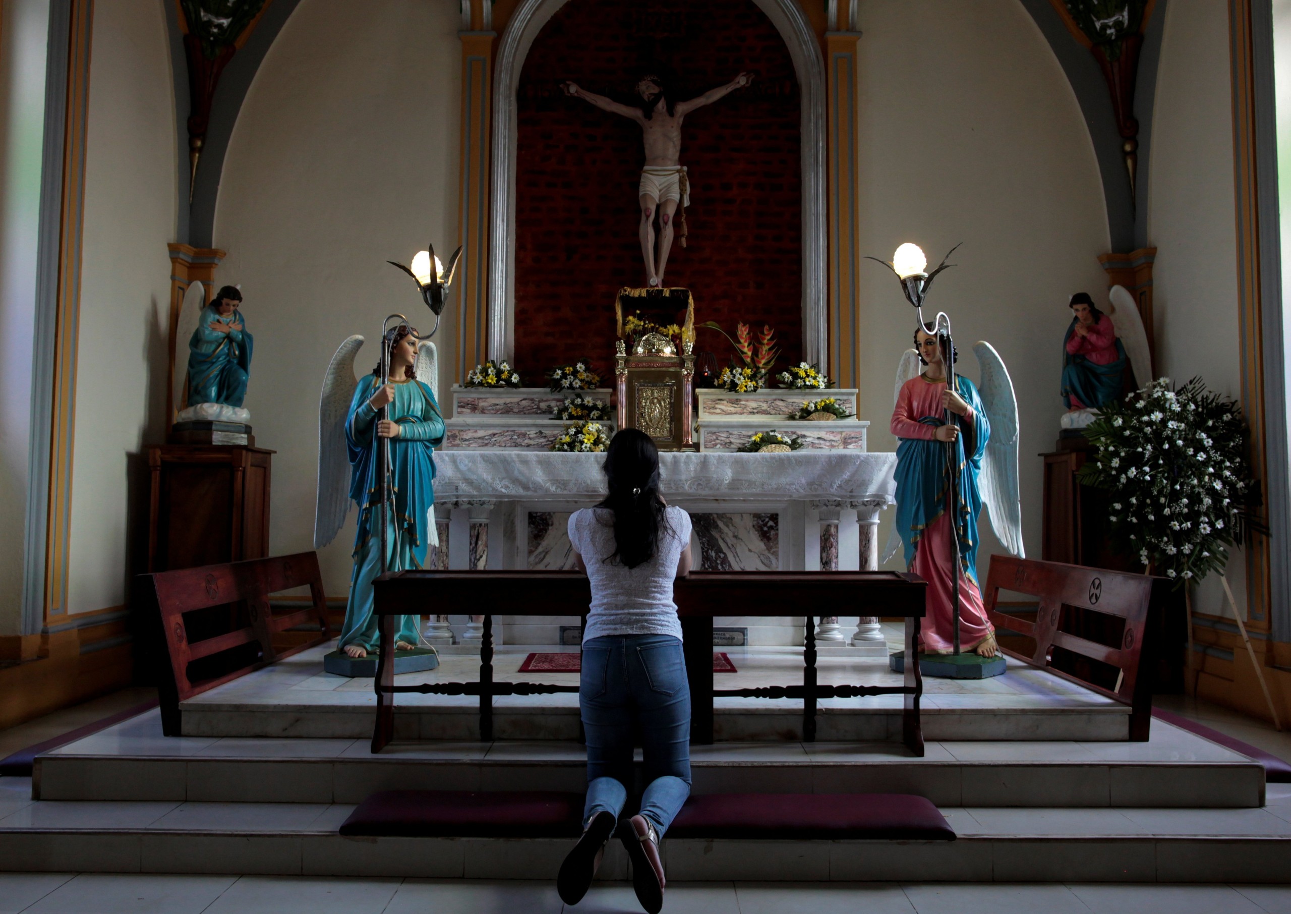 A woman prays following Mass in Nicaragua. (OSV News photo/Oswaldo Rivas, Reuters)