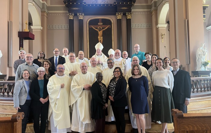 TPSM USA representatives from 18 dioceses together with Archbishop Mitchell Rozanzki and our National Director, Monsignor Roger J. Landry in the Basilica of St. Louis, King of France (Old Cathedral), in St. Louis, Missouri, during a TPMS Midwest Regional Meeting on March 25, 2025, Solemnity of the Annunciation of the Lord.