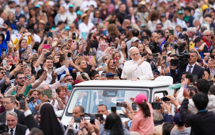 Pope Leo XIV rides through St. Peter's Square at the Vatican May 21, 2025, before holding his first weekly general audience. (CNS photo/Lola Gomez)