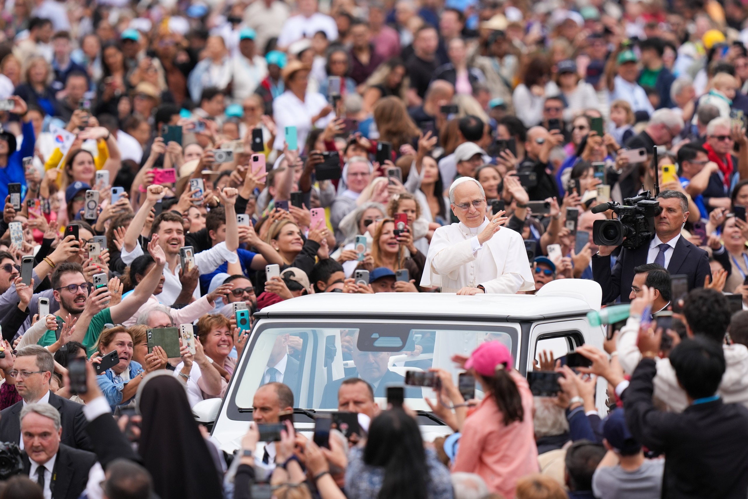 Pope Leo XIV rides through St. Peter's Square at the Vatican May 21, 2025, before holding his first weekly general audience. (CNS photo/Lola Gomez)
