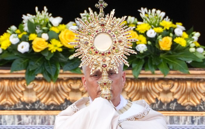 Pope Leo XVI raises the monstrance during Benediction after a Corpus Christi.