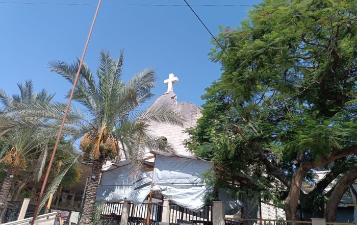 Damage can be seen next to the cross on the roof of the Holy Family Church in Gaza after it was hit in an attack July 17, 2025. At least two people died and another 11 were injured, including the parish priest, Father Gabriele Romanelli, who sustained a slight injury to his right leg. (CNS photo/courtesy Aid to the Church in Need, UK)